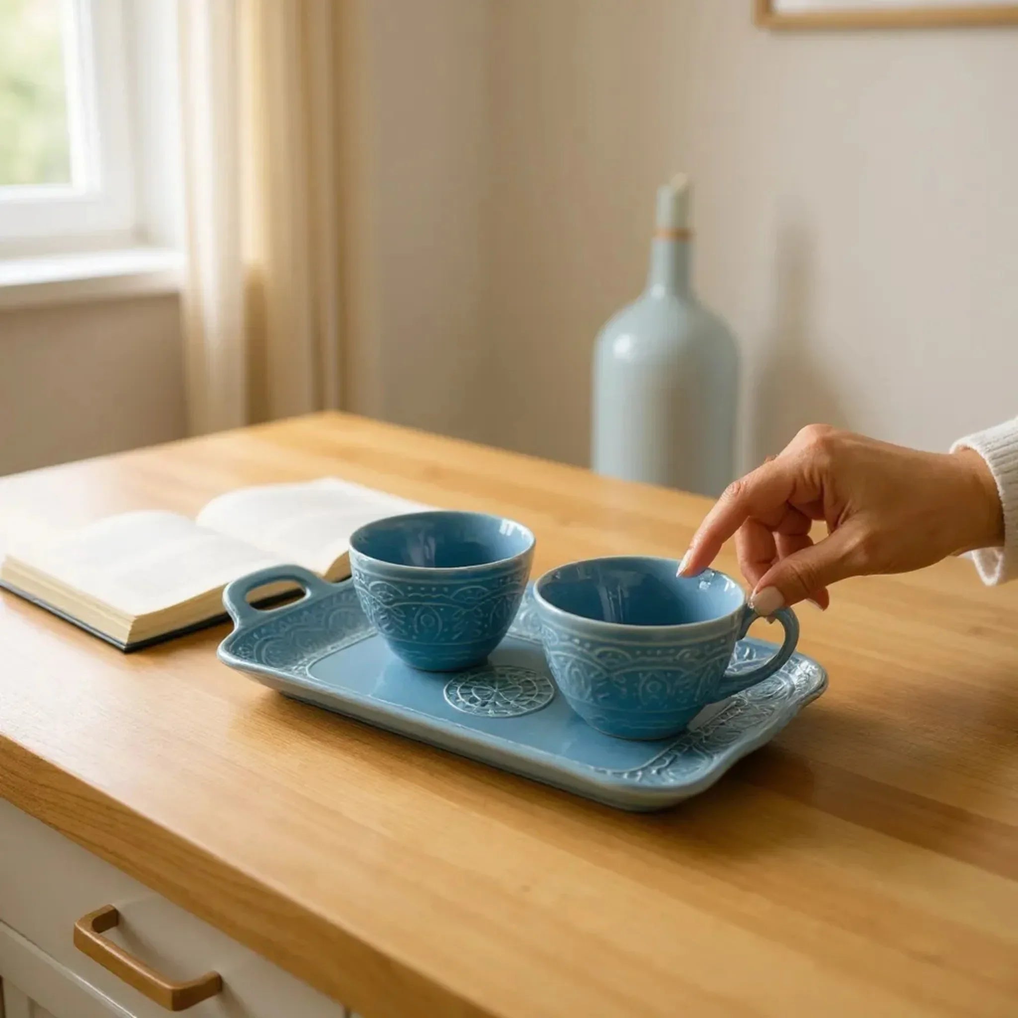 150ml blue ceramic cup with ergonomic handle; compact size for espresso or small tea servings.