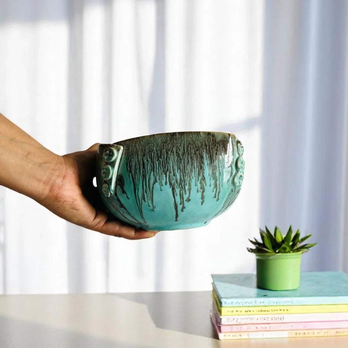 Unique button-rim detail; handcrafted blue glaze and artisanal pottery craftsmanship for luxury homes.
