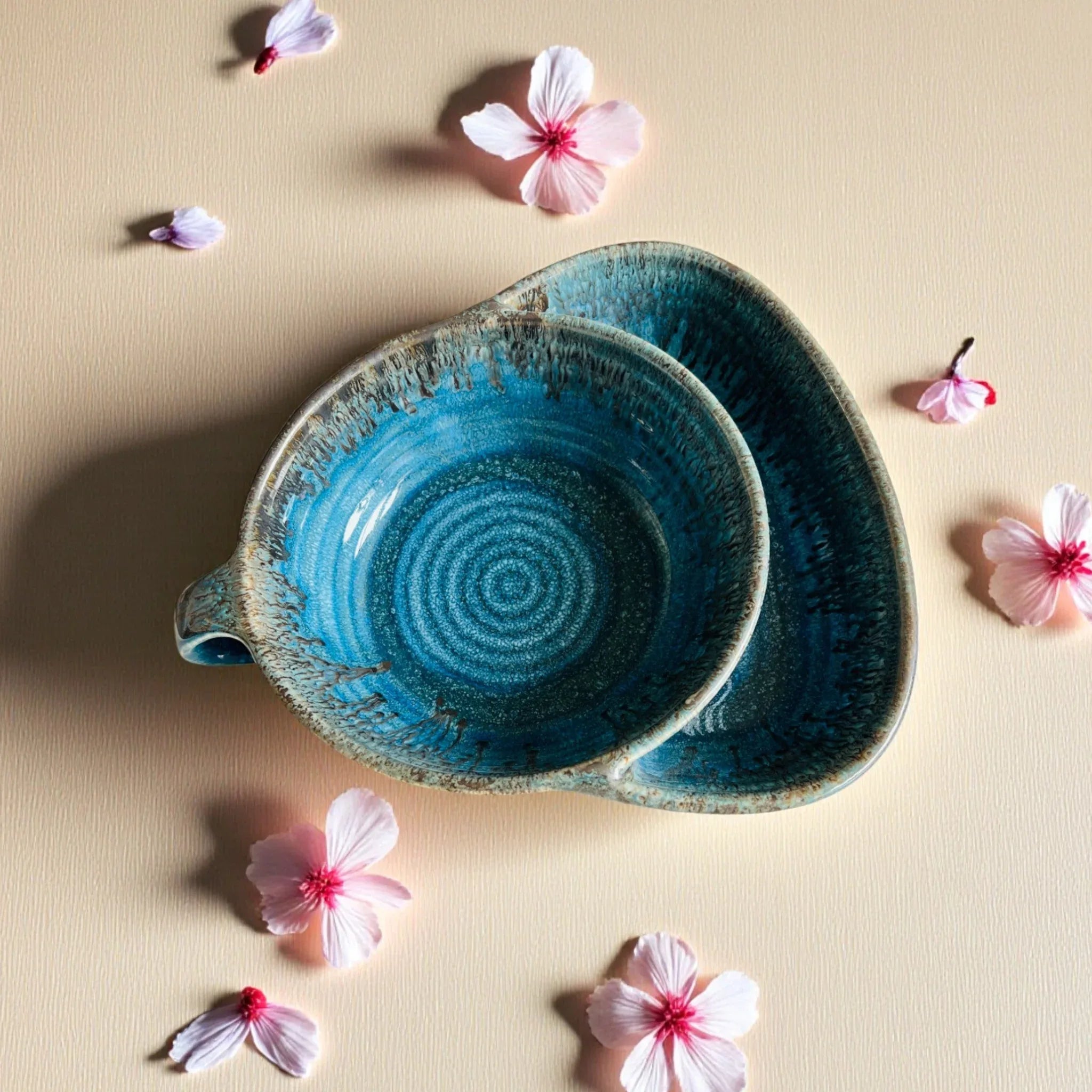 Top view of the bowl; a close-up of the rich blue reflective finish and the sturdy, handcrafted handle design.