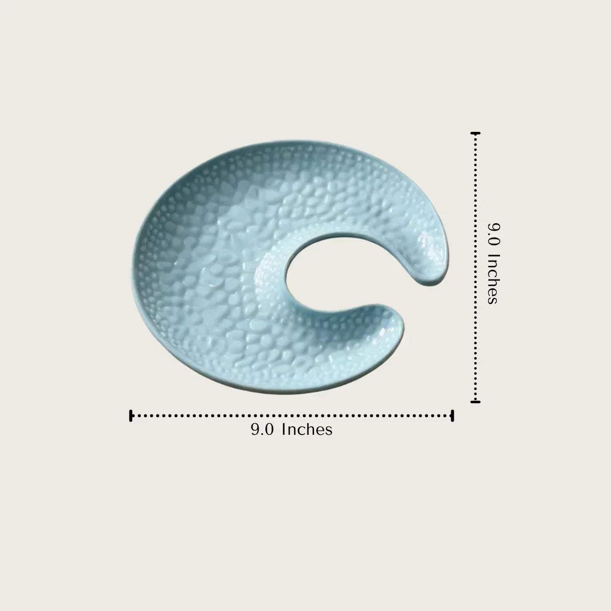 Moon-shaped ceramic platter with dimensions; width and length measurements for elegant tabletop planning and serving.