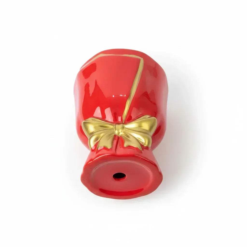 Close-up of planter and golden ribbon; vibrant high-gloss red finish with hand-painted metallic gold-lined details.