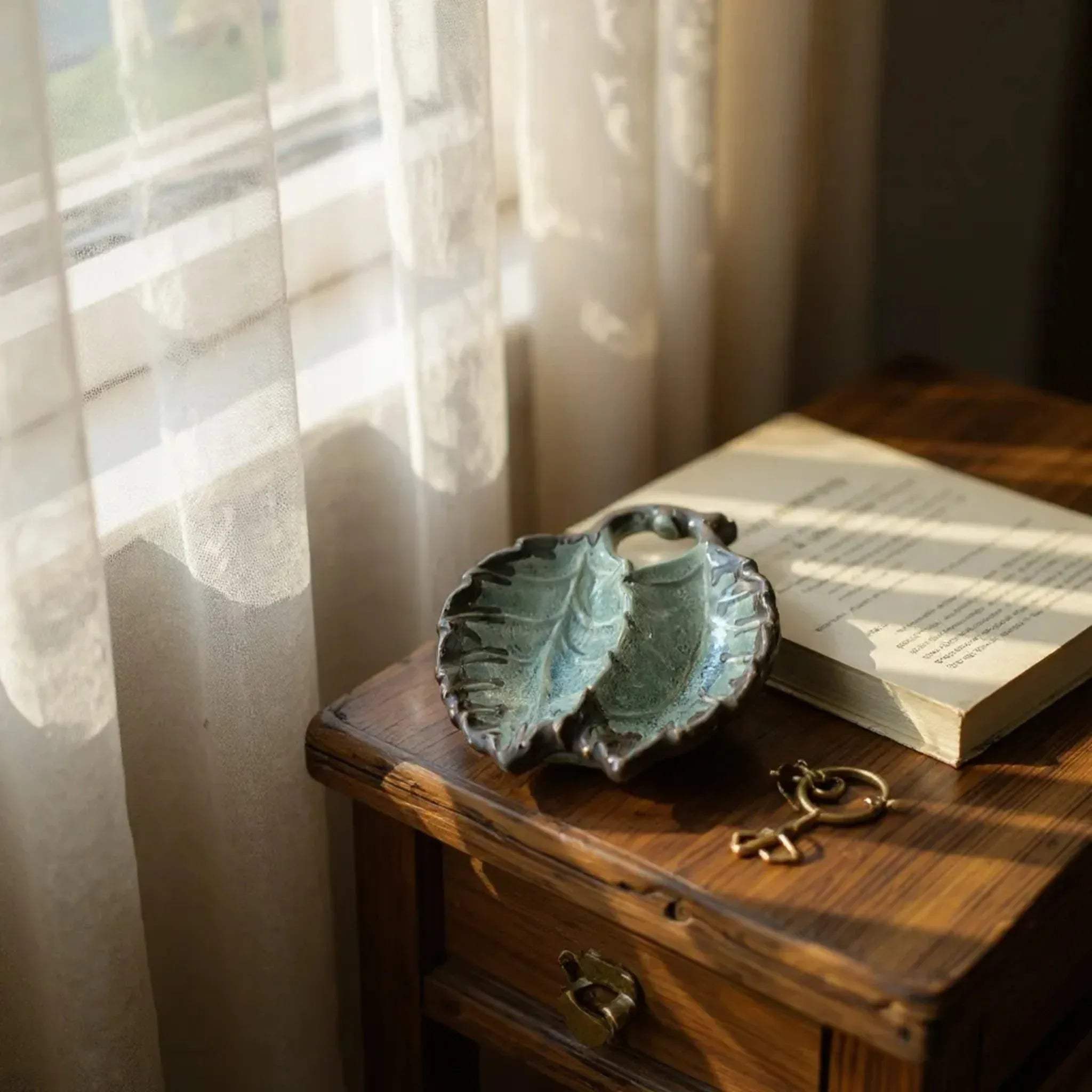 Dressing table organization; using the leaf-shaped tray to separate small rings and earrings elegantly.