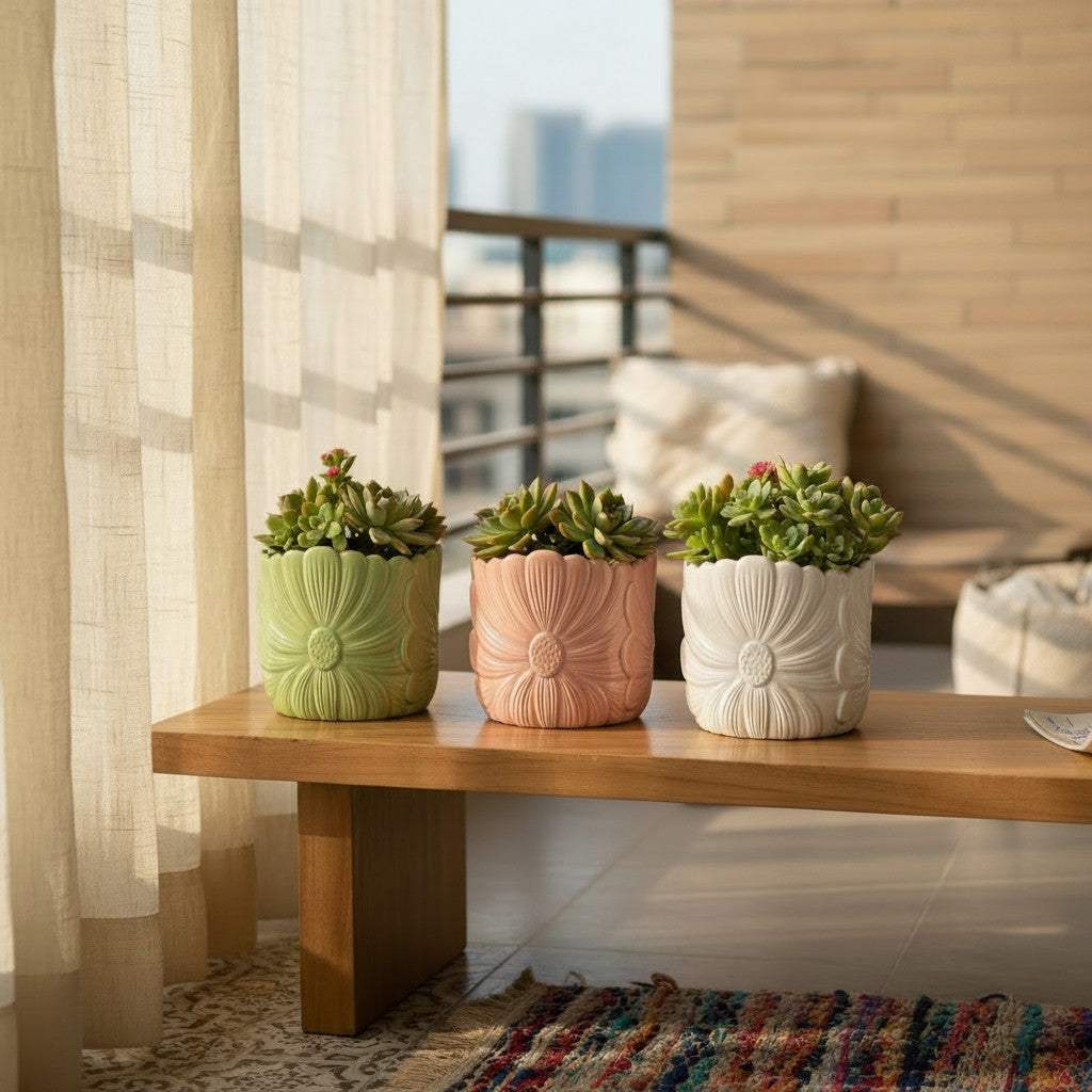 The trio of pink, green, and white embossed flower planters curated together as an elegant corporate desk gifting set.