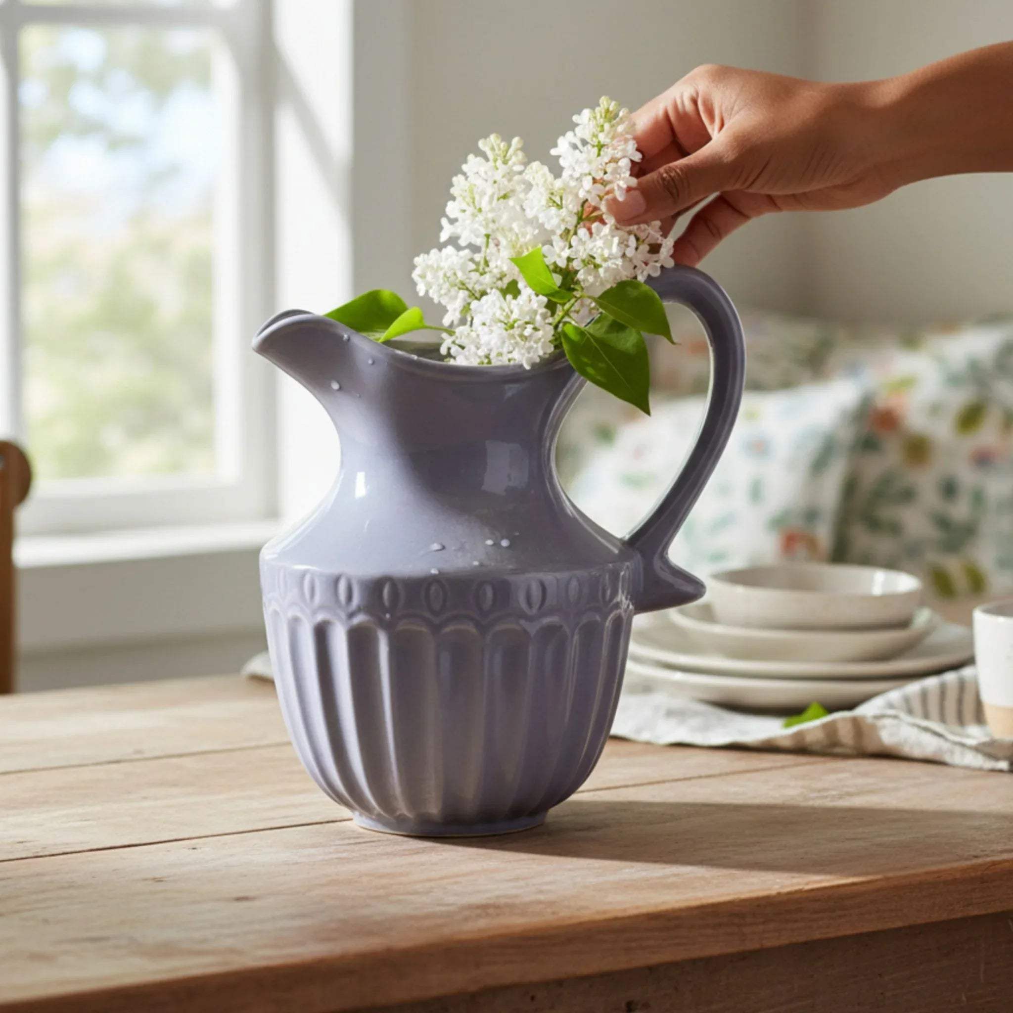 Decorative centerpiece; the Sky Mist pitcher used as a flower vase holding a bouquet of wildflowers.