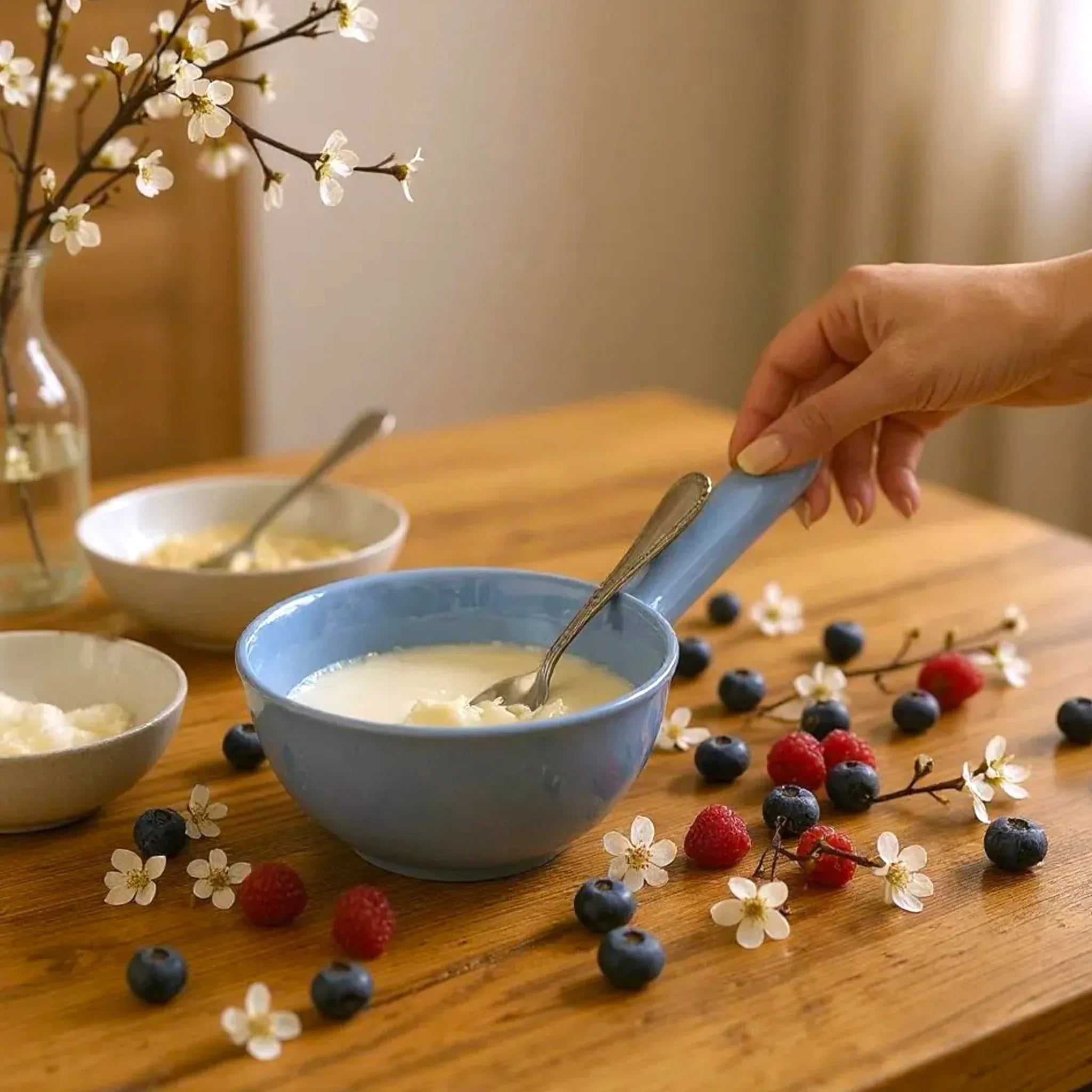 A cozy date night; the Sky Mist bowl filled with yogurt, surrounded by strawberries and marshmallows.