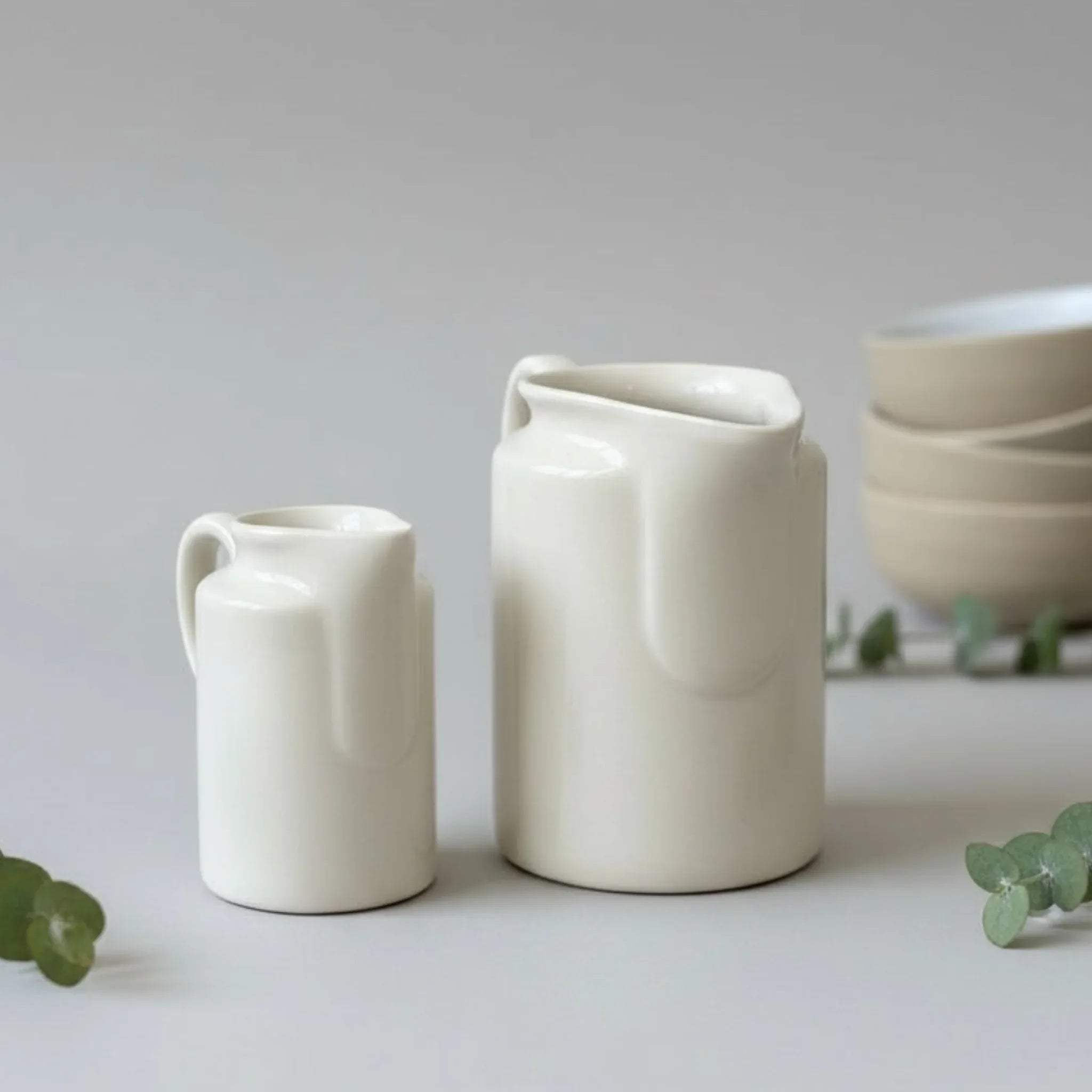 Smooth ivory glaze; drip-free spout design and ergonomic handcrafted ceramic handle.