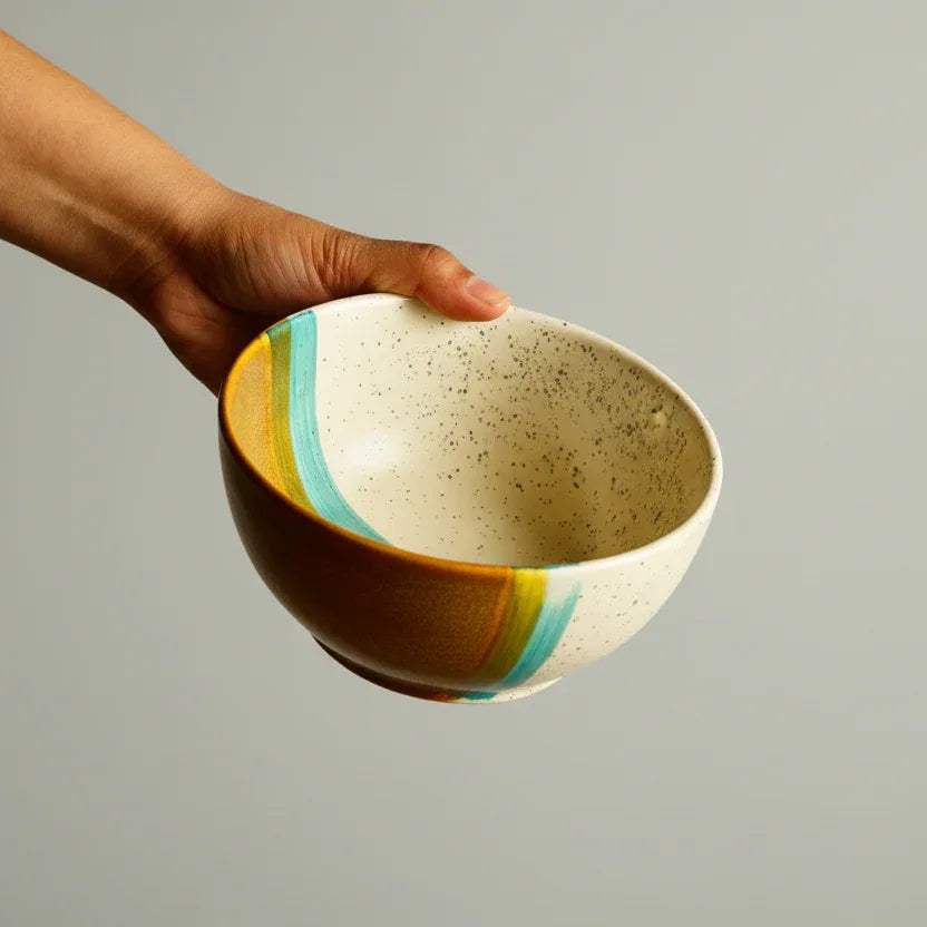 Reactive sea-foam glaze; handcrafted textured rim and artisanal blue pottery finish.