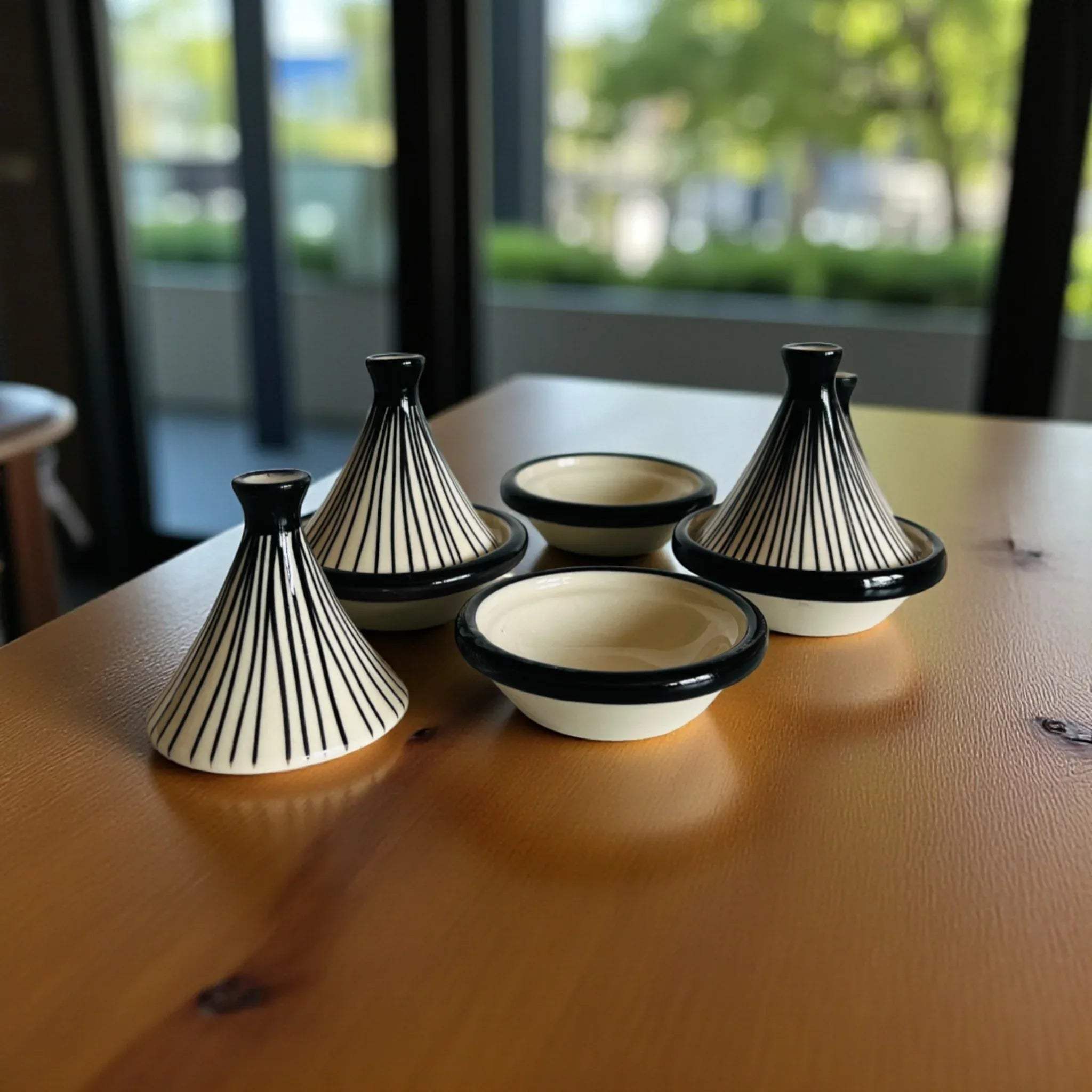 Mini tagine size; compact ceramic lids designed for moisture retention and decorative tabletop display.