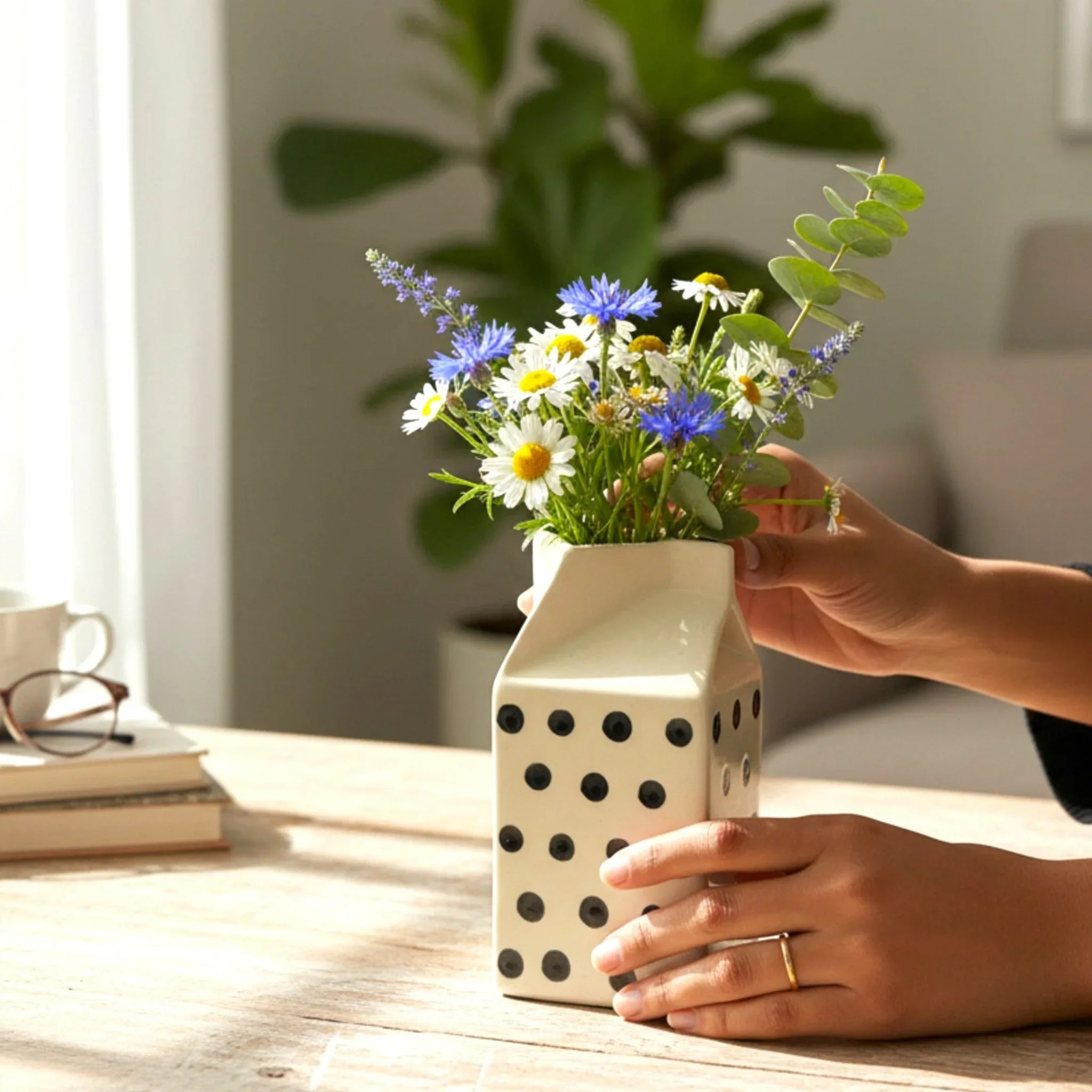 Artistic glaze; a close-up of the hand-painted spots and the smooth, ergonomic handle and spout design.