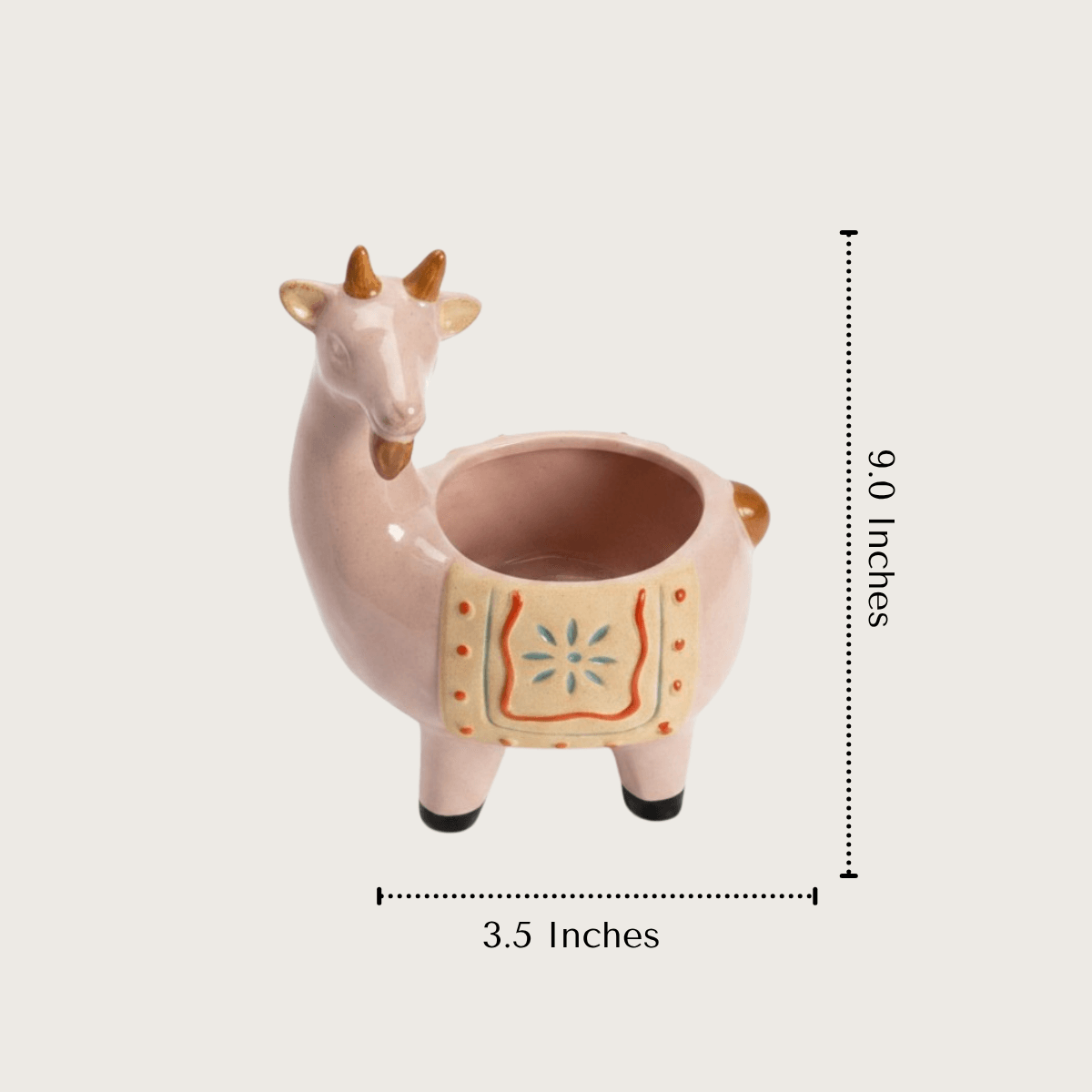Product measurement diagram showing the 9.5 inches height, length, and breadth dimensions of the sculptural pink ceramic pot.