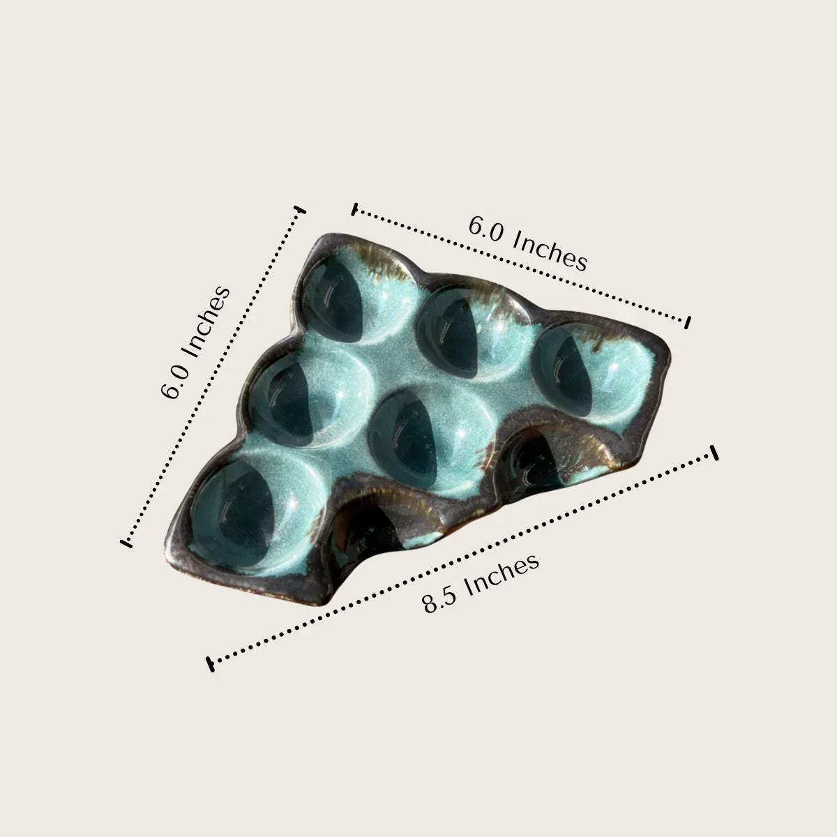 6-egg storage tray with shiny blue glaze perfect for countertop organization.