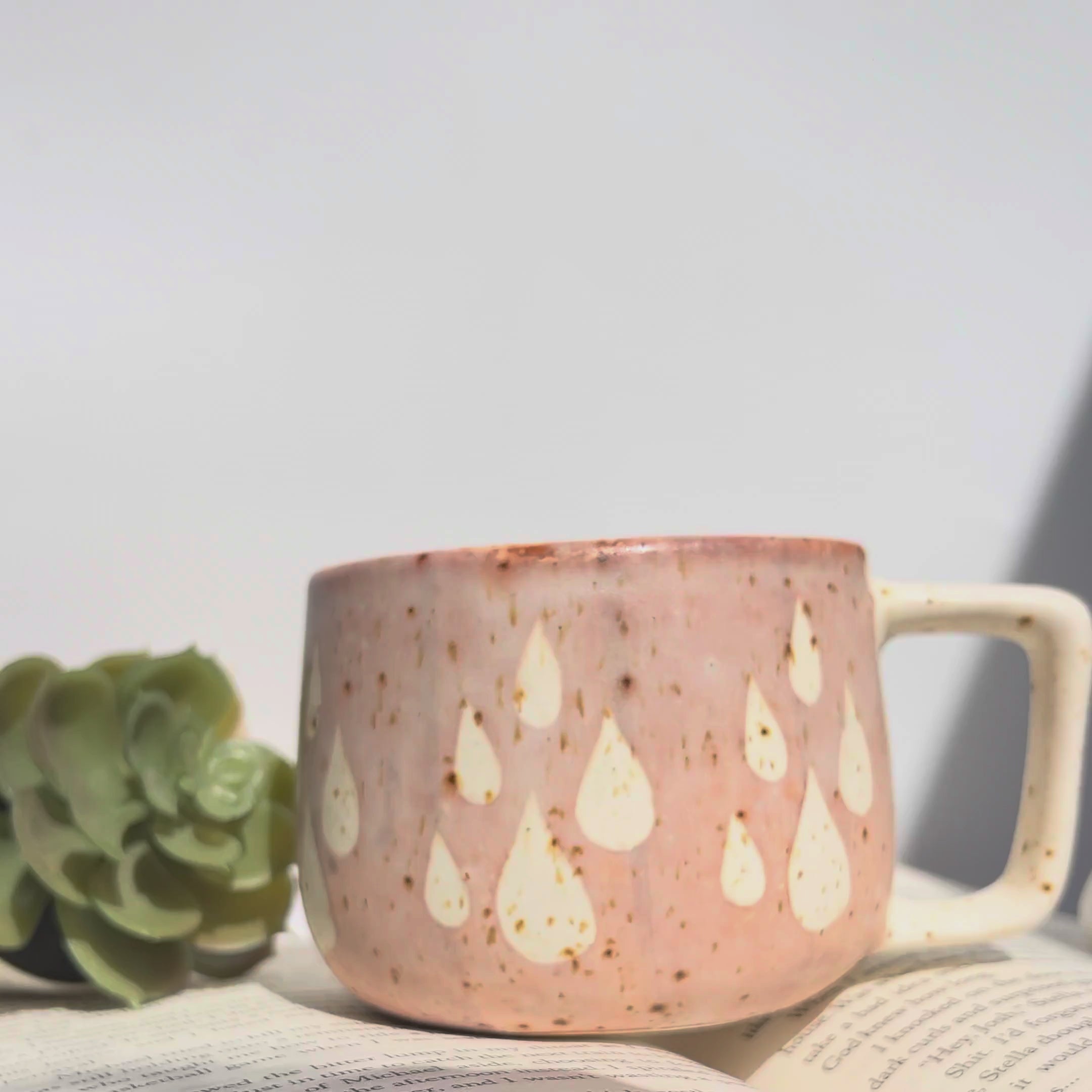 Pink and purple Dewdrop Mugs stacked; highlighting the organic shapes and complementary pastel tones.