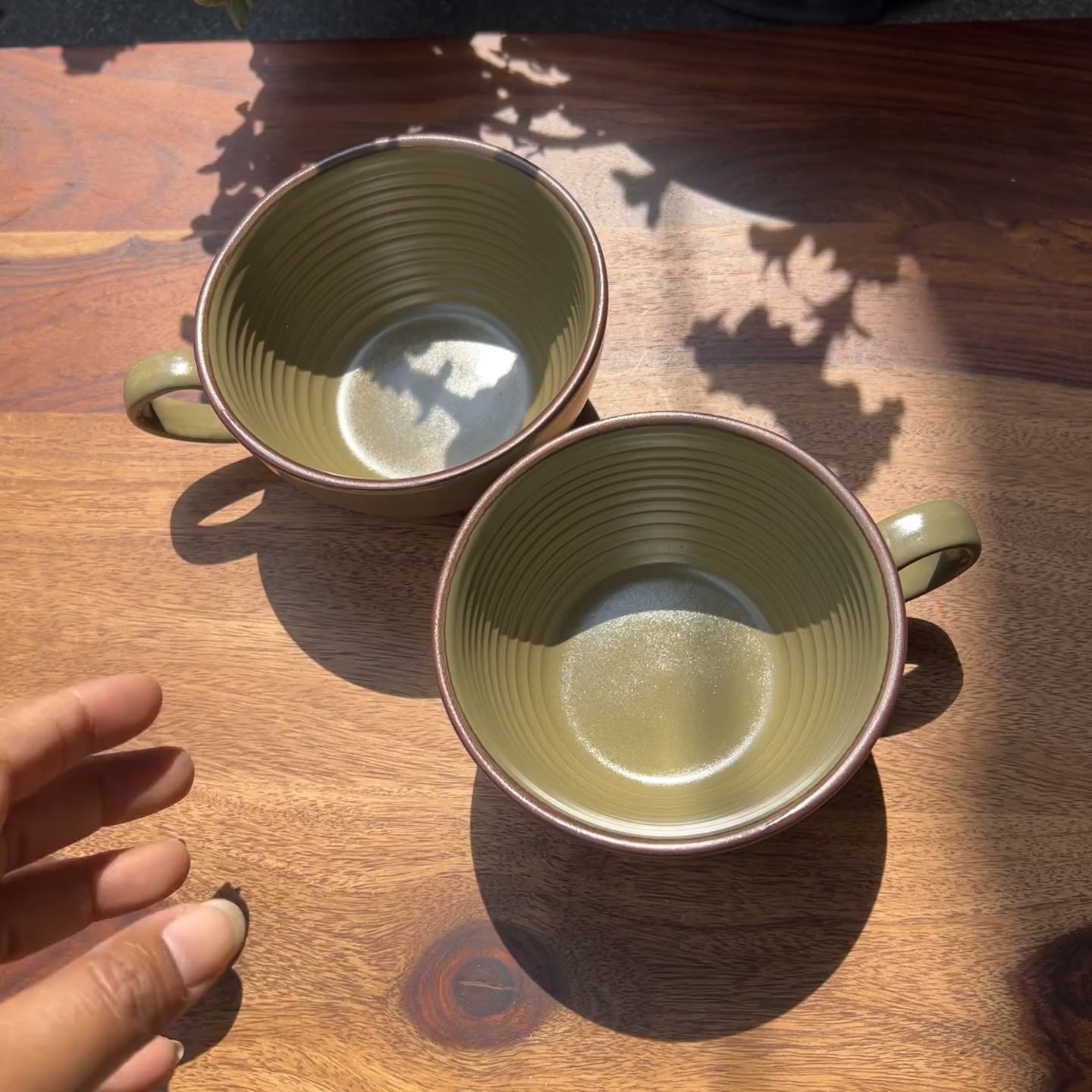 Product video of ceramic green cups perfect for coffee.