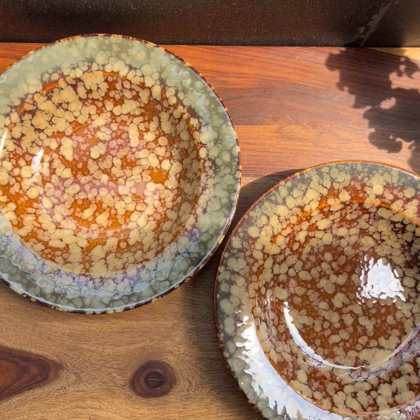 Product video of brown blue ceramic pasta plate with reactive glaze.
