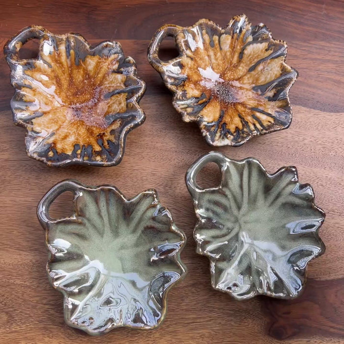 Product video of ceramic leaves in brown and green with a holder.