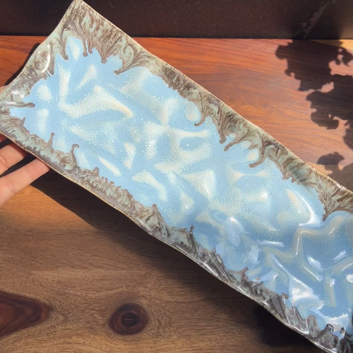 Product video of blue ceramic platter perfect for sushi.
