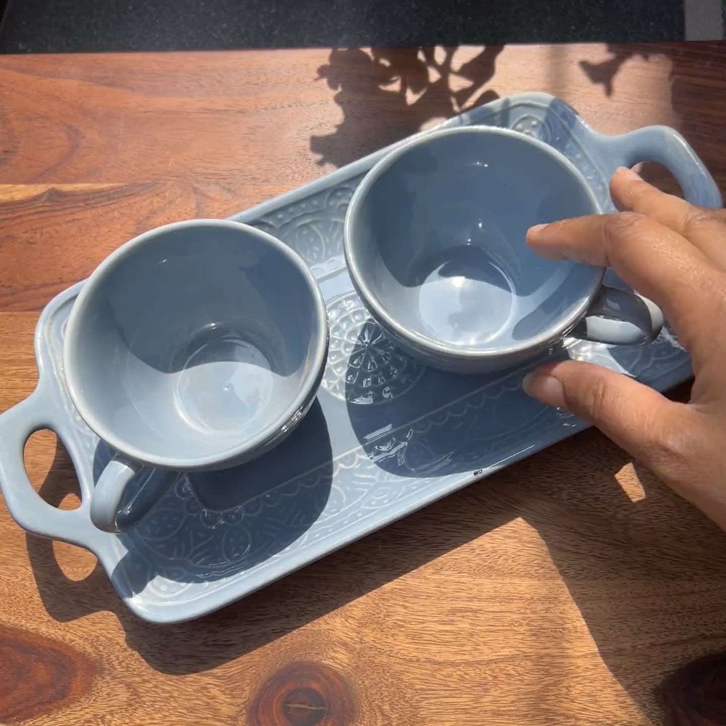 Product video of ceramic blue tray and cup set; microwave and dishwasher safe.