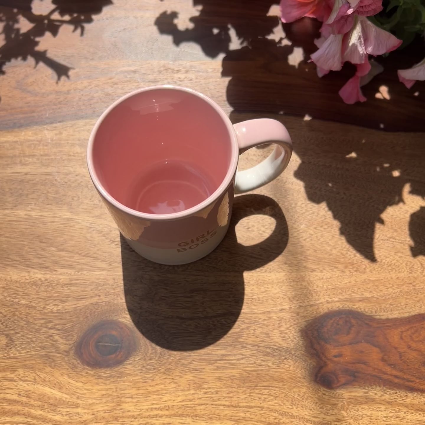 Product video of pink and white ceramic mug with girl boss gold foiling.