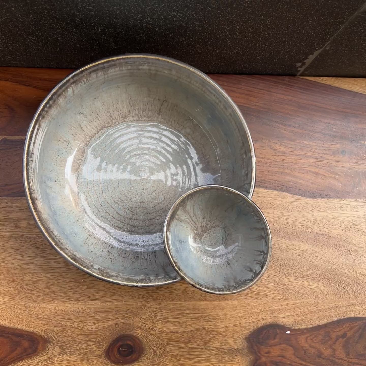 Product video of ceramic grey / silver chip and dip bowl.