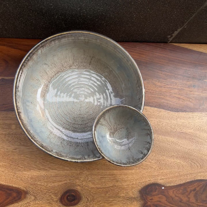Product video of ceramic grey / silver chip and dip bowl.
