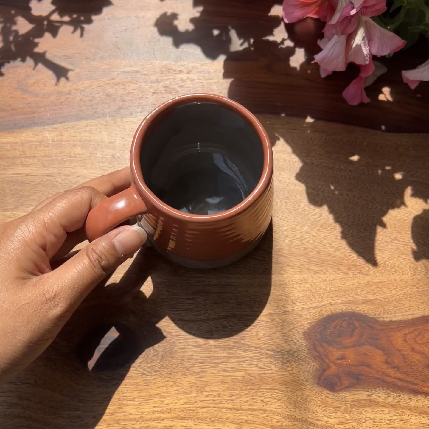 Product video of ceramic brown-grey coffee mug; Microwave safe.