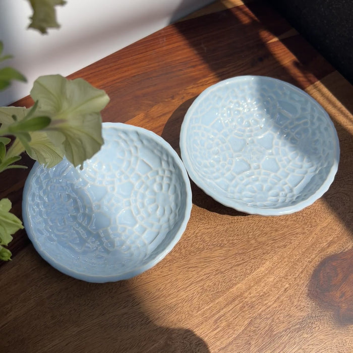Product video of the Sky Mist Monkey Dish featuring a unique light blue reactive glaze and intricate geometric patterns.