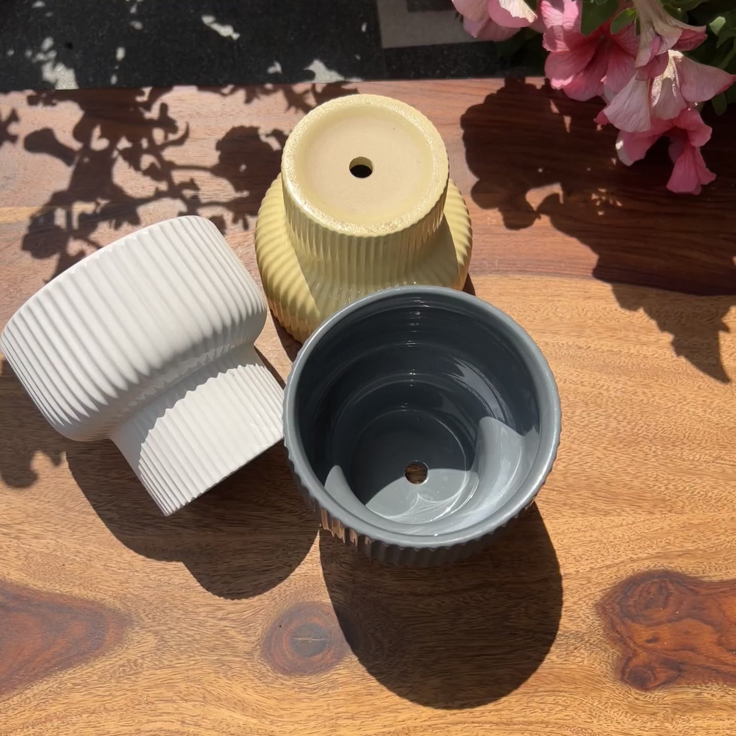 Product video of martini planters showing the ribbed texture and glossy finish in 3 colors - grey, white and yellow.
