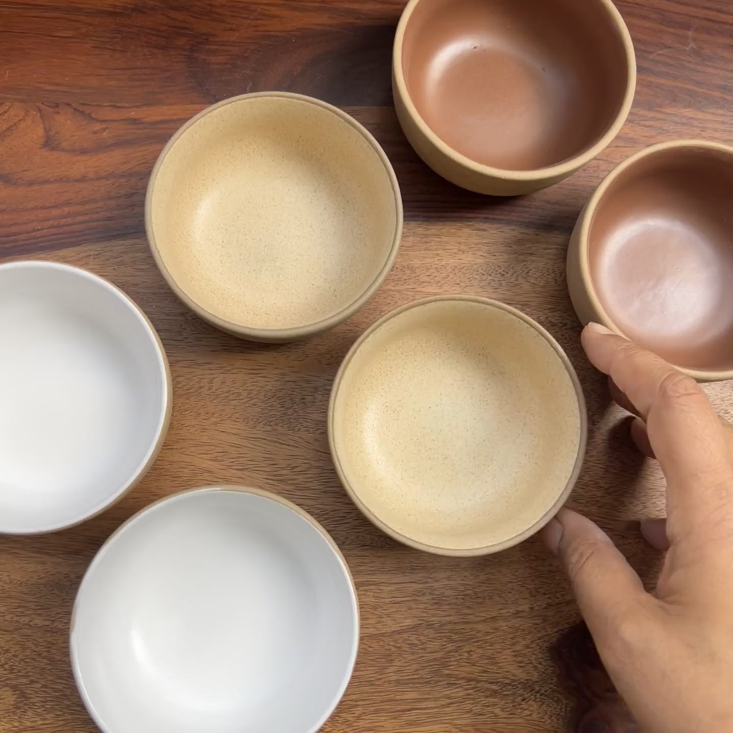 Product video of 6 ceramic bowls in neutral colors showing the size and dimensions.