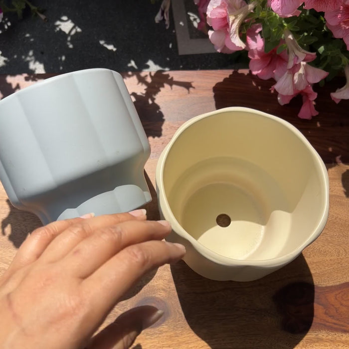 Product video of balance planters showing the smooth matte finish and the yellow and grey colors.