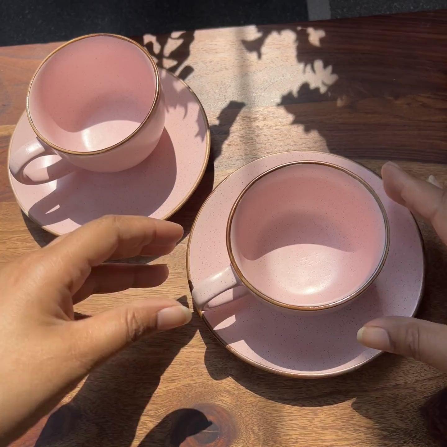 Product video of pink ceramic cup and saucer set; microwave safe.