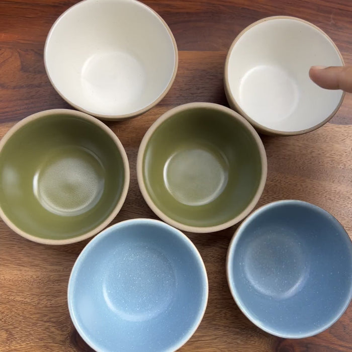 Product video of ceramic bowls in multiple colors green, blue and white.