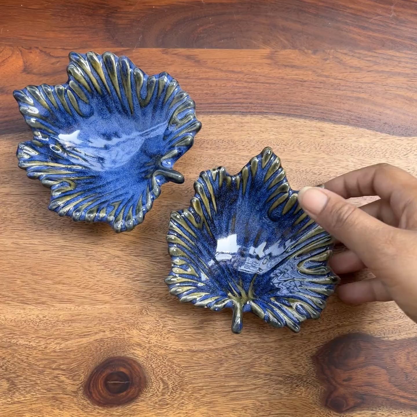 Product video of ceramic blue maple leaves.