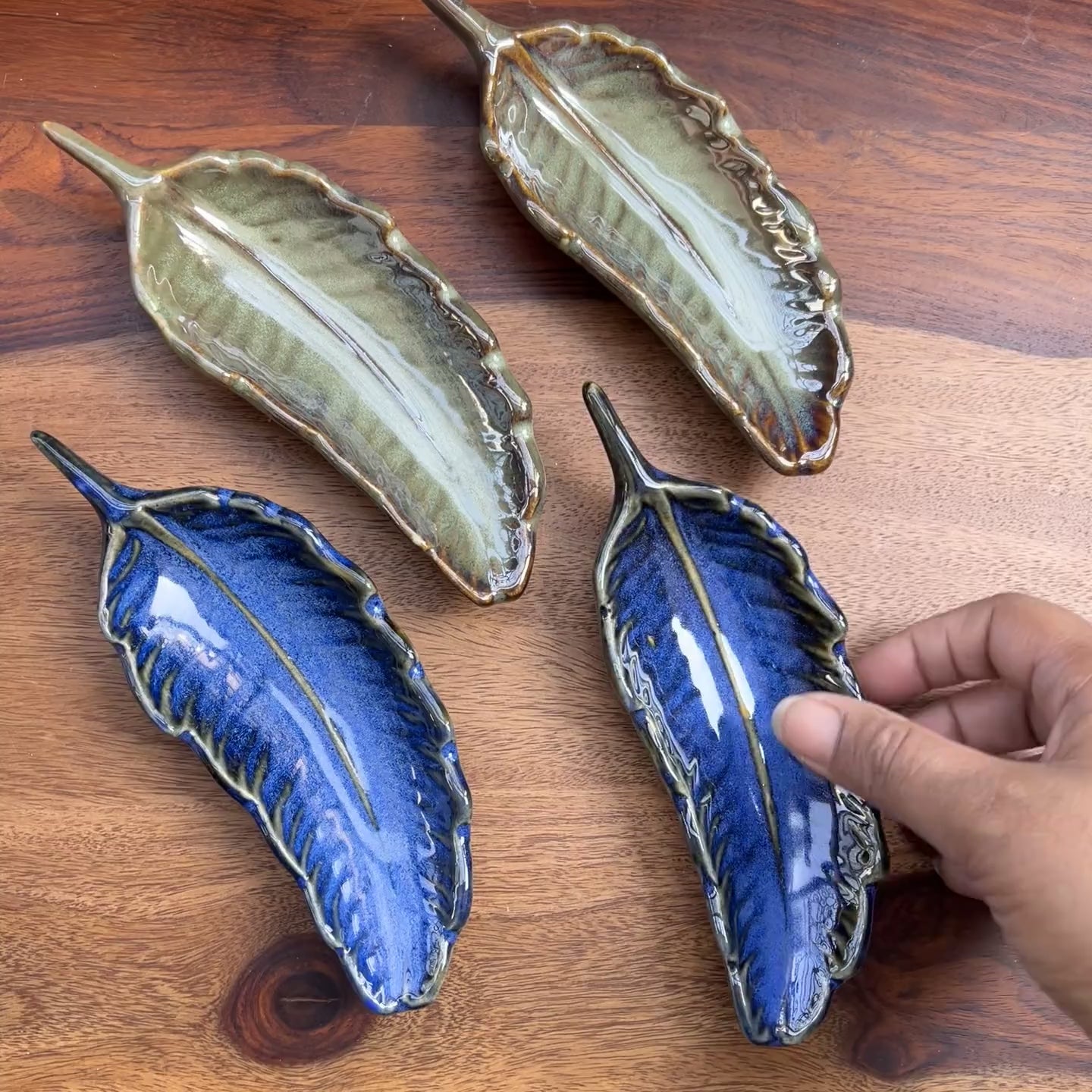 Product video of blue ceramic leaf.