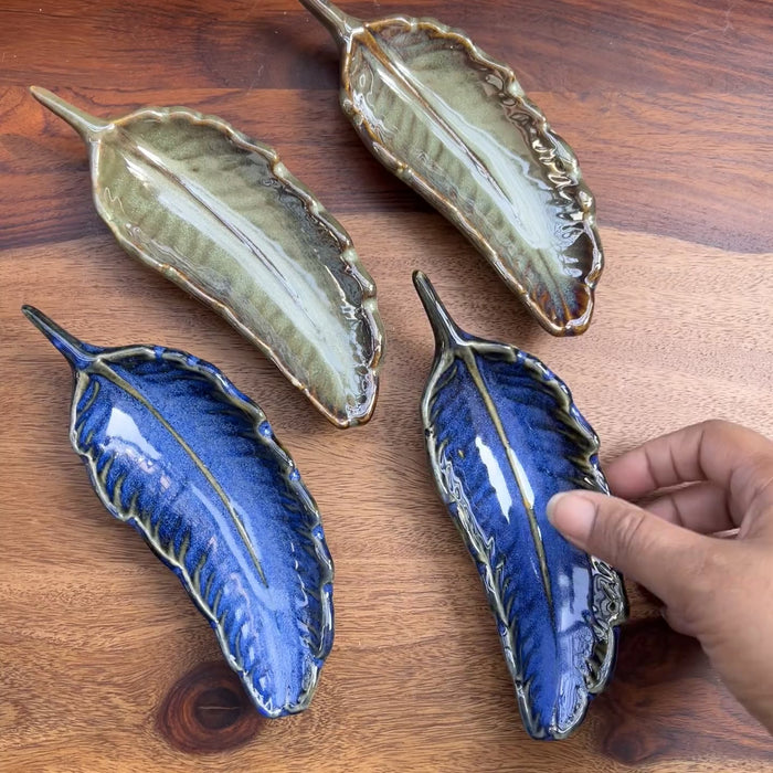 Product video of blue ceramic leaf.