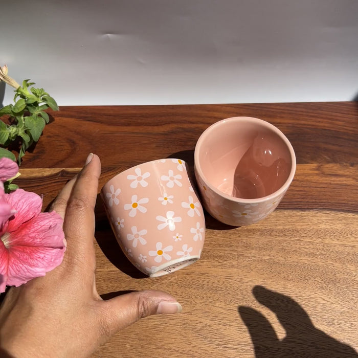 Product video of pink petal perch planters for artificial plants - white daisy printed design.