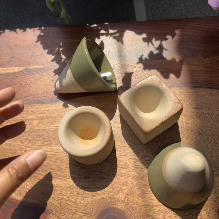 Product video of green ceramic espresso set with a triangle cup and a circle or square base.
