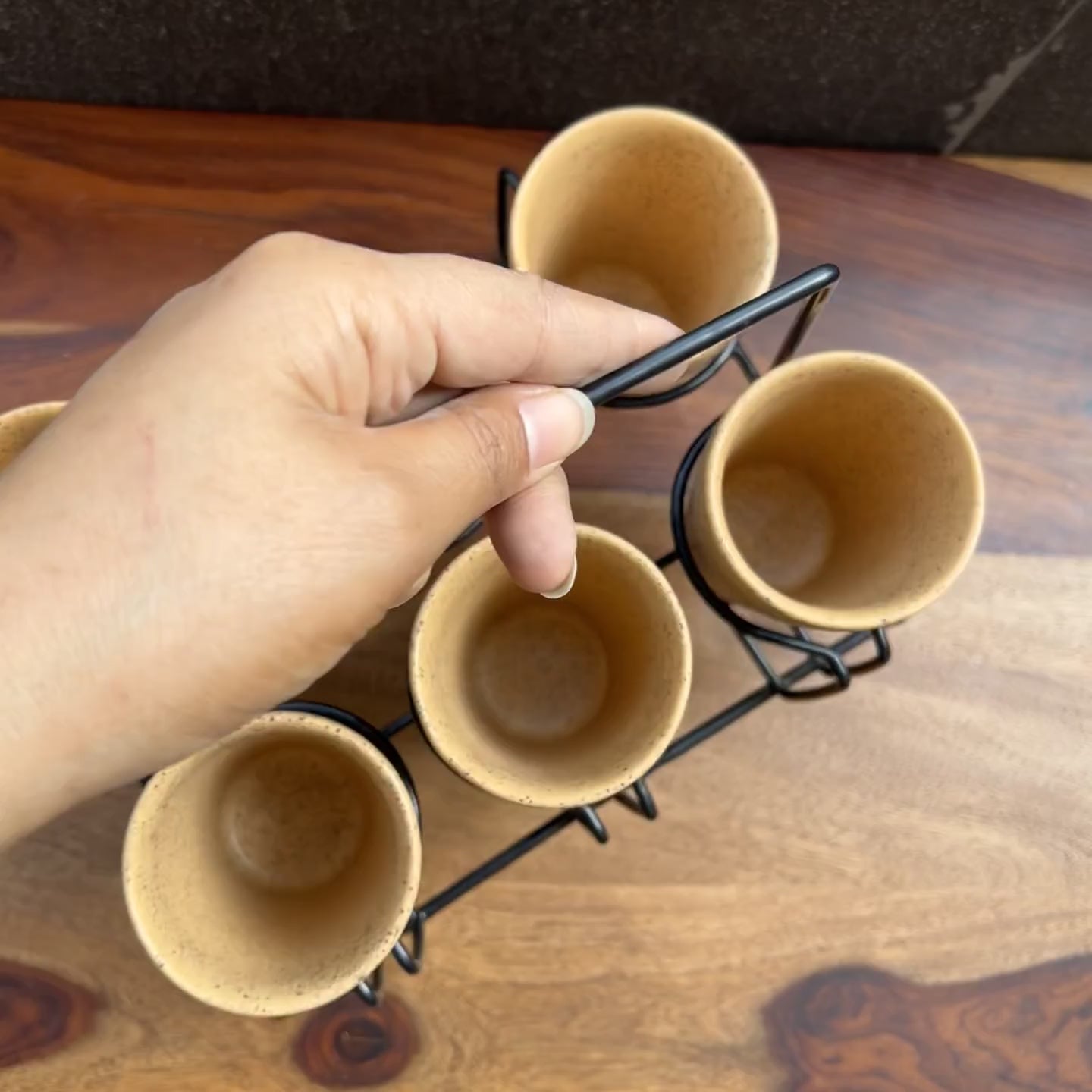 Product video of yellow kulhad tea set with metal stand.