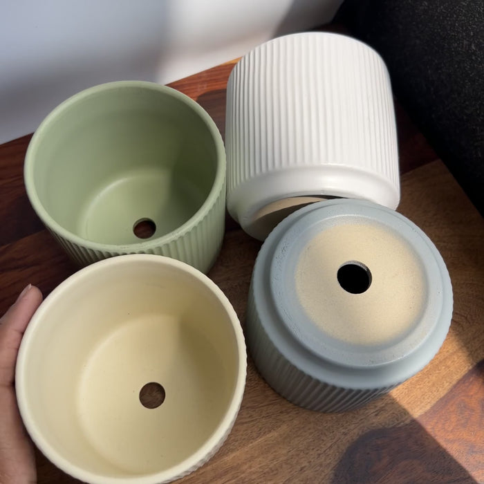 Product video of harmony planter showing the ribbed texture and the four matte pastel colours - green, yellow, grey and white.