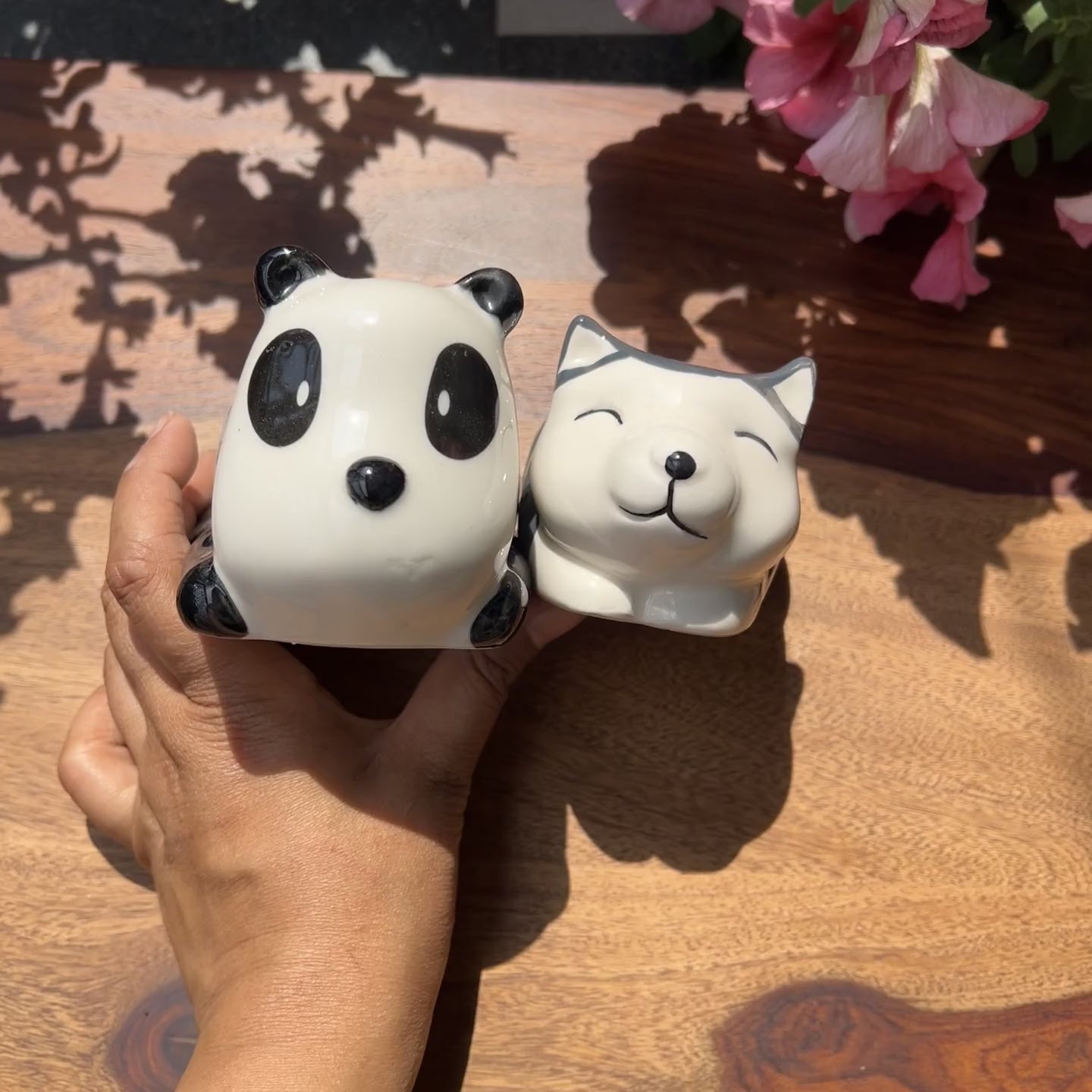 Product video of panda and dog shaped planters; drainage roots and unglazed interior for healthy roots. 