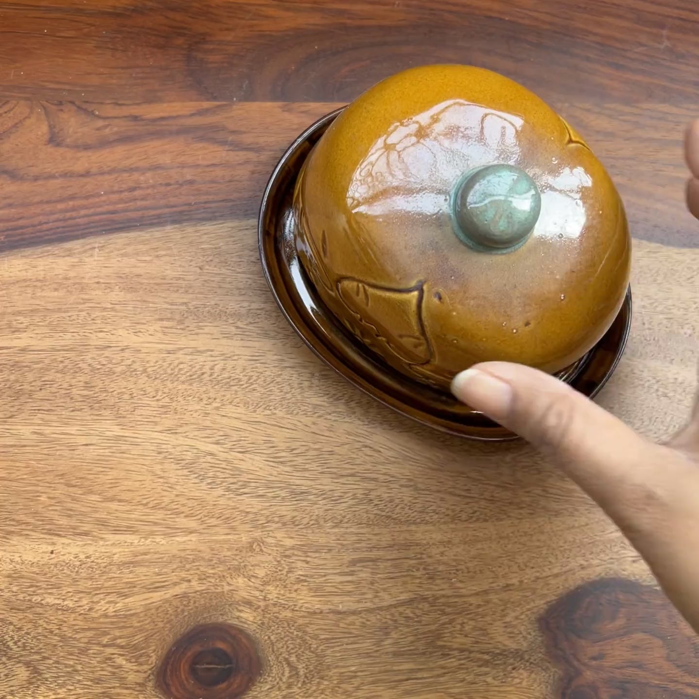 Product video of brown butter dish with etchings.