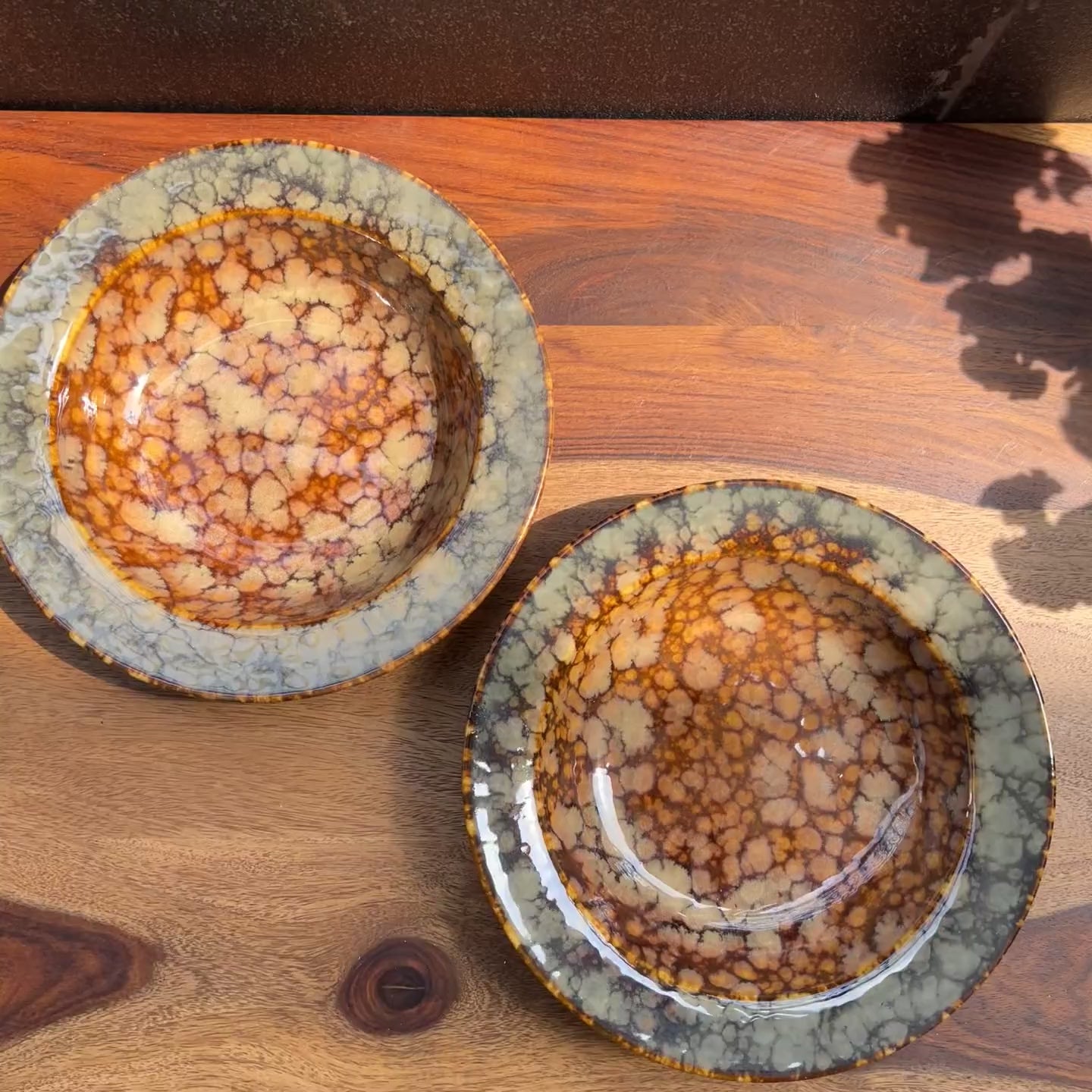 Product video of ceramic reactive brown glaze for noodle plates / bowls.