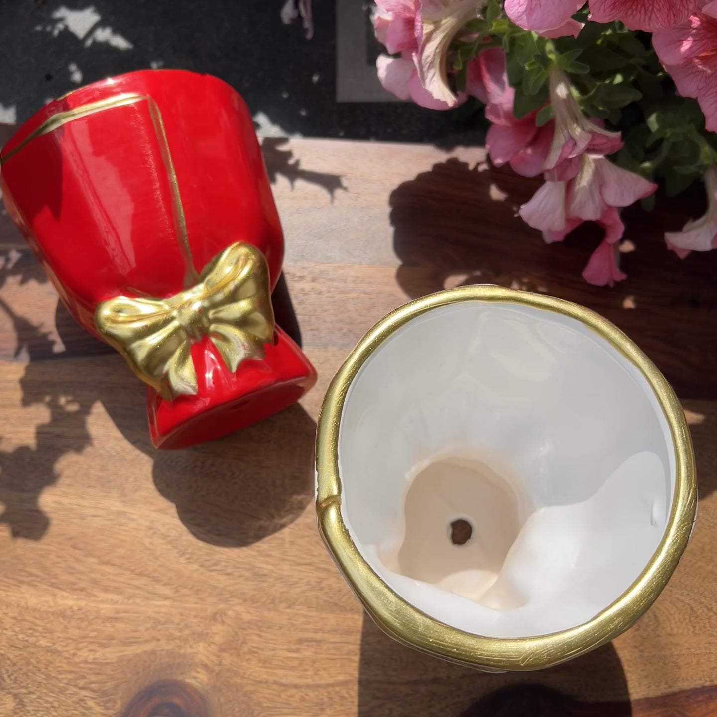 Product video of bouquet shaped planters in red and white with gold bow detailing; drainage roots and unglazed interior for healthy roots. 