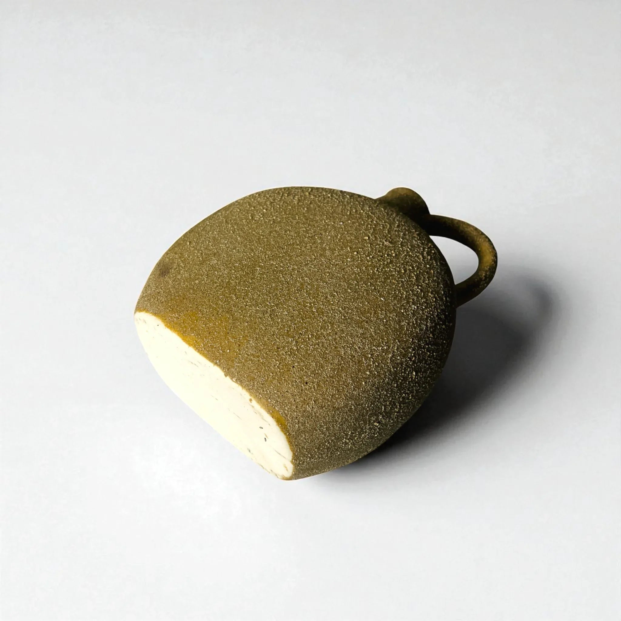 Bottom view of a textured ceramic vase; unique housewarming gift for nature lovers and aesthetic entryway decor.