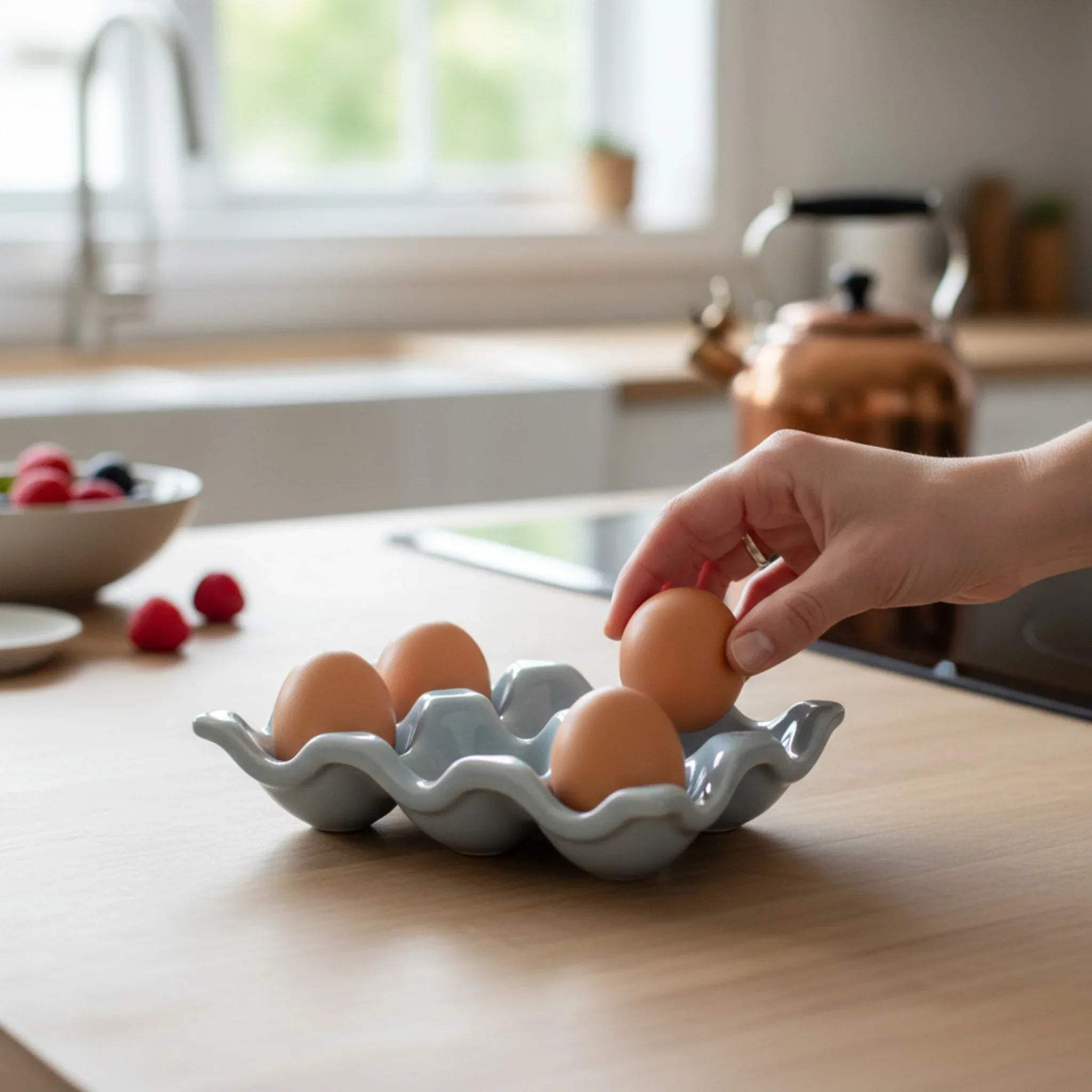 Ceramic egg holder in use; unique gift for bakers and luxury kitchen accessory for organized home chefs