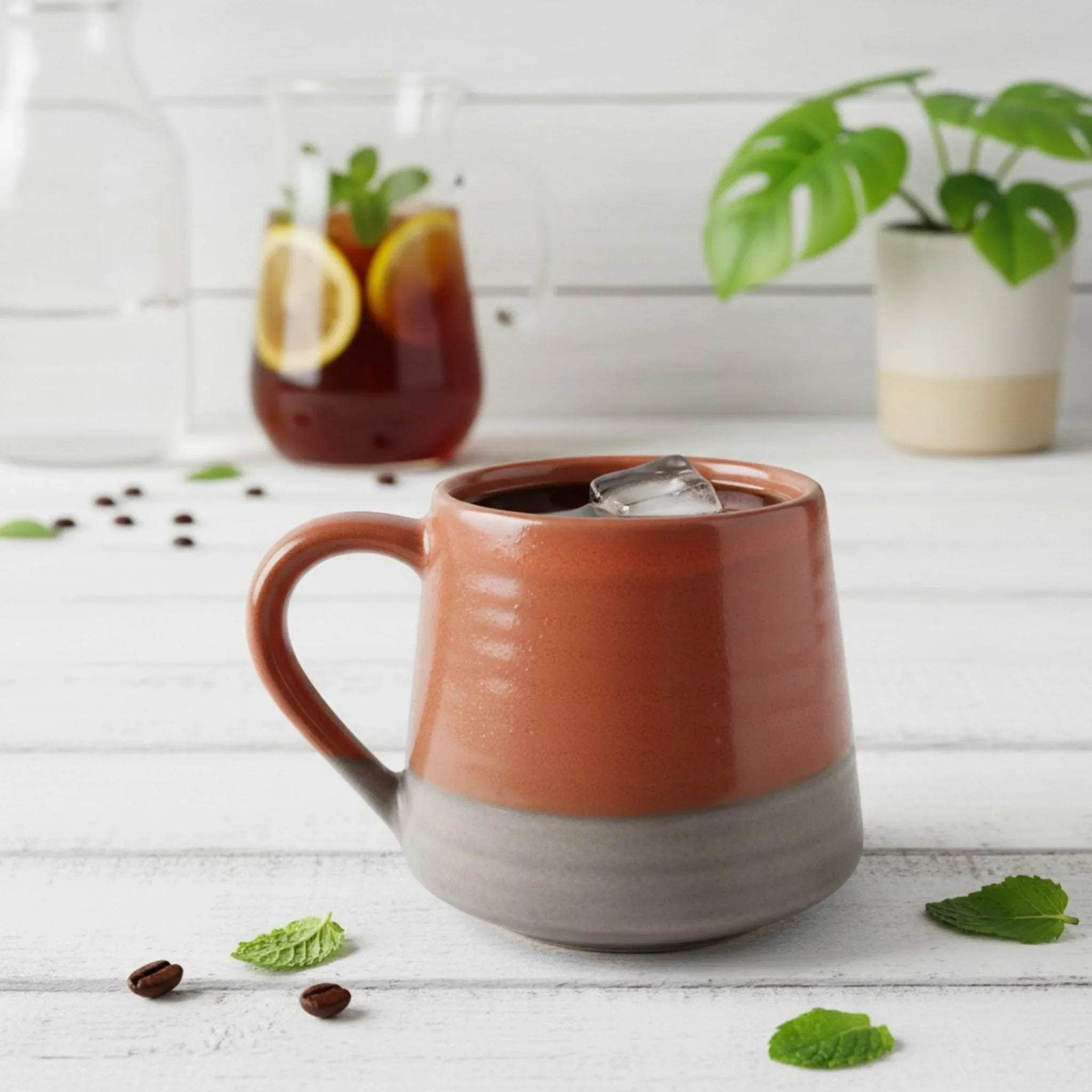 Close-up of Ember Ash Mug; handcrafted volcanic ash texture and reactive matte glaze on a grey ceramic vessel.