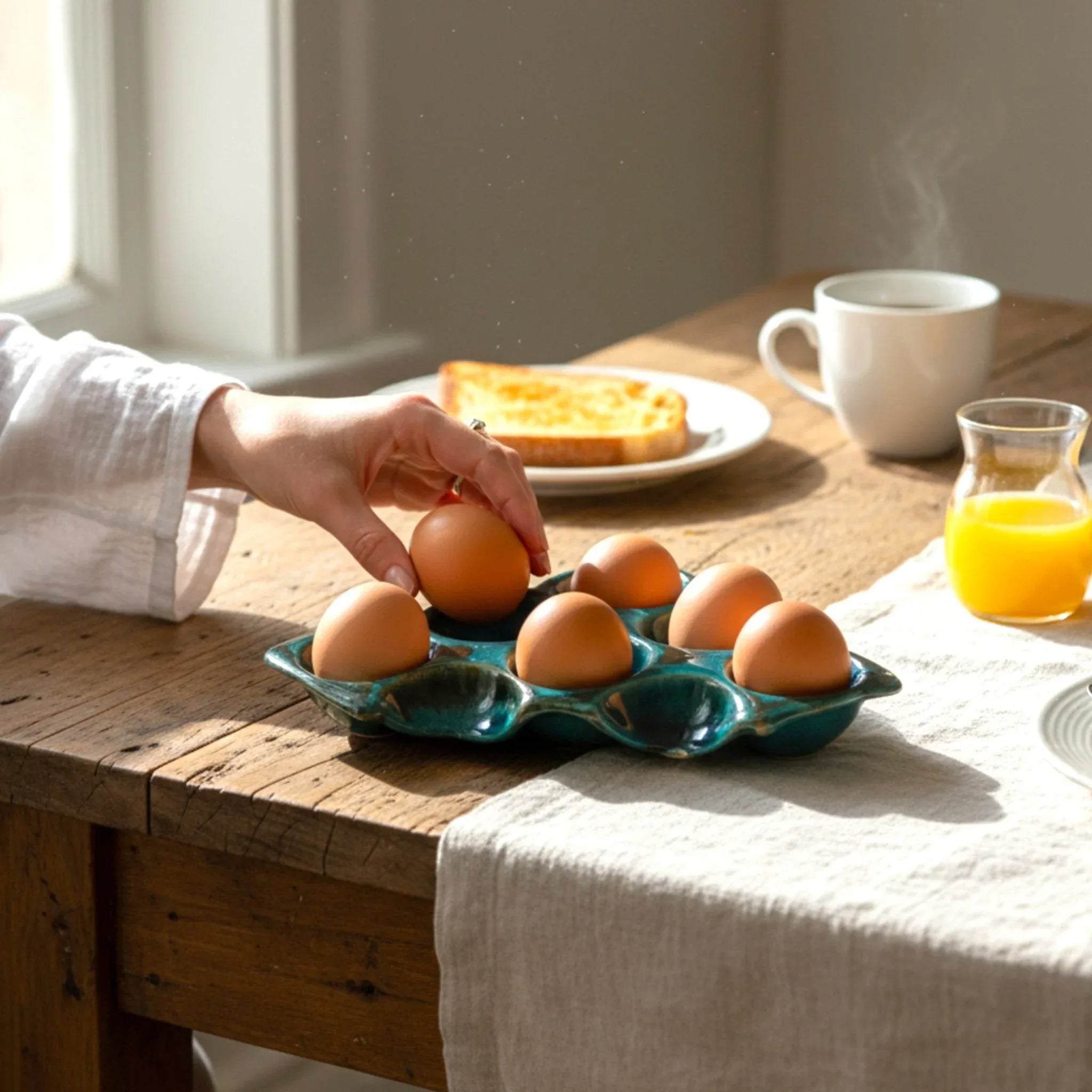 Ocean Mirage Egg Tray; elegant ceramic holder with 6 slots, styled with farm-fresh eggs on a stone counter.