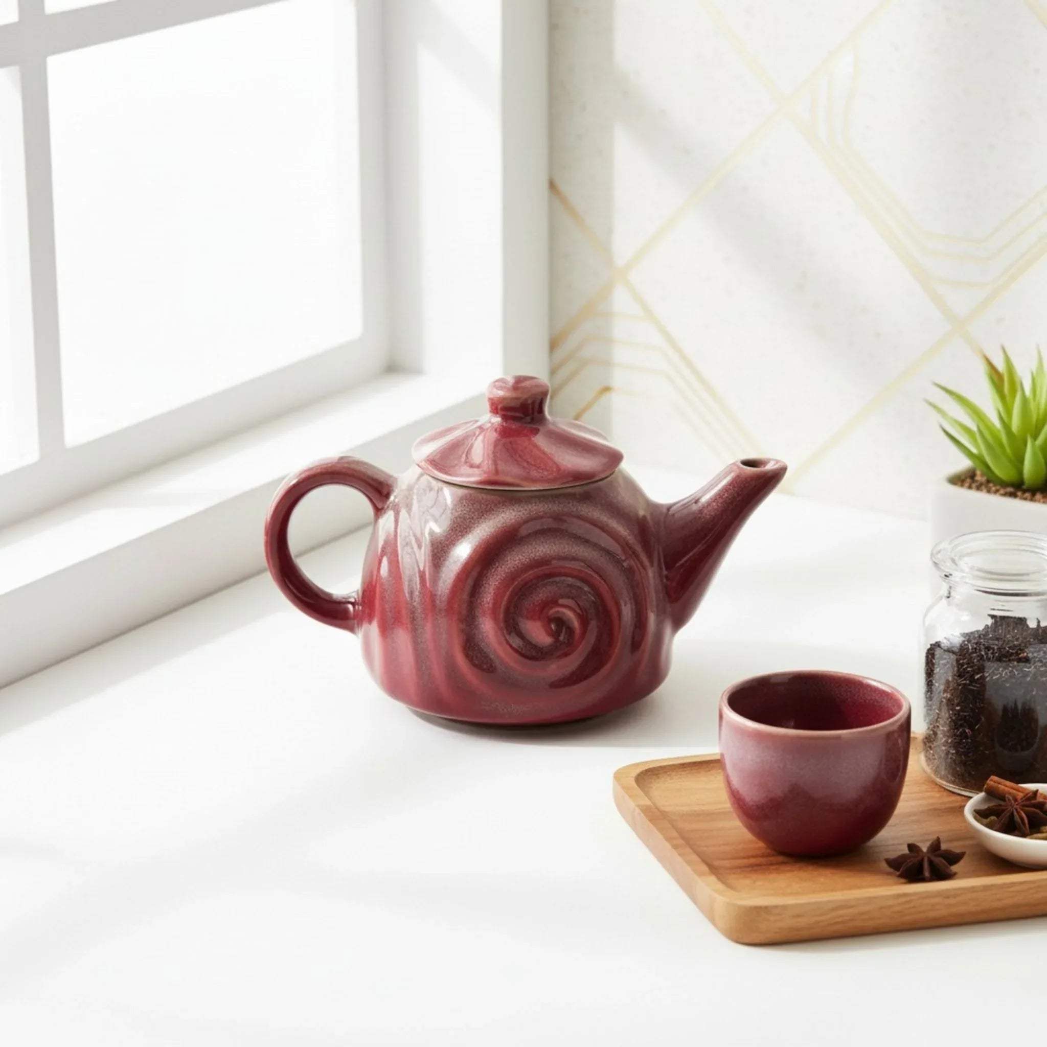 Close-up of Ruby Swirl texture; handcrafted embossed spiral design with a glossy burgundy reactive finish.