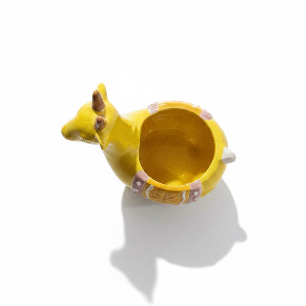 Bottom view showcasing the hole-free solid leakproof base of the ochre ceramic planter to keep home furniture dry.