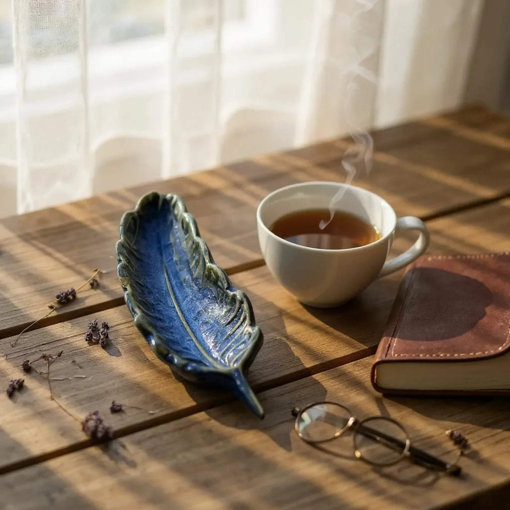 Solo Leaf Trinket Dish Set; leaf-shaped ceramic trays with realistic vein textures and a glossy finish.