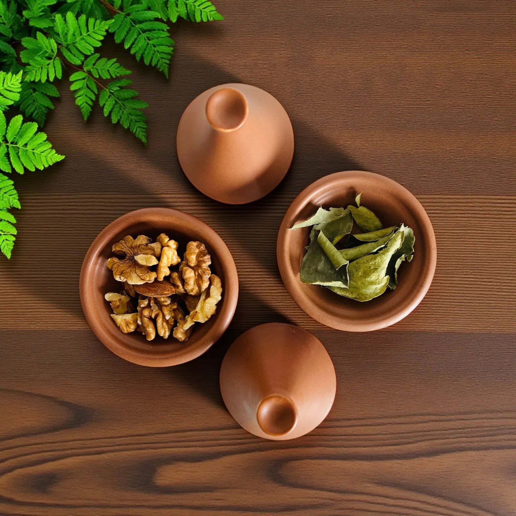 Terracotta Mini Tagine Set; two handcrafted ceramic bowls with conical lids in a warm, natural clay tone.
